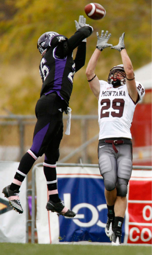 Trent Nelson  |  The Salt Lake Tribune&#xA;Montana's Bryce Carter pulls in a touchdown reception during the first half, Weber State vs. Montana, college football Saturday, October 30, 2010. Weber State's Marvin Walker defending.