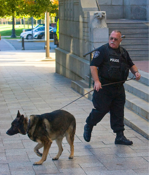 Al Hartmann  |  The Salt Lake Tribune&#xA;law enforcement officer does a security check with a police dog in front of the  Frank E. Moss Federal Courthouse during the start of jury selection for the Brian David Mitchell trial on Monday, Nov. 1. Mitchell is accused of kidnapping Elizabeth Smart.