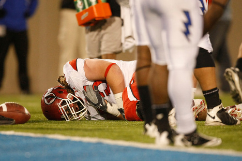 Chris Detrick  |  The Salt Lake Tribune &#xA;Utah Utes offensive linesman John Cullen #75 remains on the ground during the first half of the game at Falcon Stadium Saturday October 30, 2010.   Utah is winning the game 14-10.