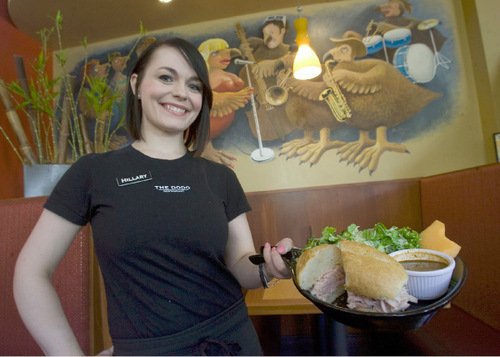 Al Hartmann  |  The Salt Lake Tribune

Hillary Marostica serves up one of the The Dodo's menu favorites, a turkey sandwich with barbeque sauce.