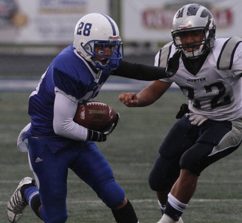 Rick Egan   |  The Salt Lake Tribune&#xA;&#xA;Marques Herrera (28) carries the ball for the Miners, as Siuta Tuineau (32) defends for Hunter  in football action, Bingham vs. Hunter high at Bingham,  Saturday, October 30, 2010.