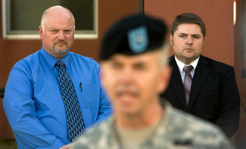 Steve Griffin  |  The Salt Lake Tribune
Bluffdale mayor Derk Timothy and Herriman Mayor Josh Mills listen Wednesday to Brigadier General Jefferson S. Burton, who is the Assistant Adjutant General - Army, Utah National Guard, as he explains some of the changes Camp Williams is undergoing to help prevent any future fires from starting at Camp WIlliam.