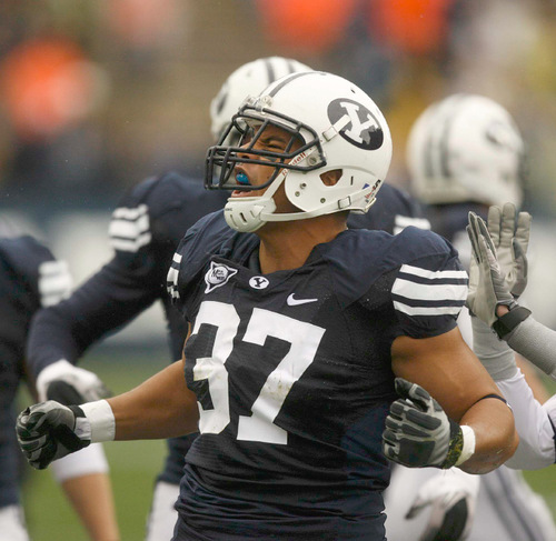 Trent Nelson  |  The Salt Lake Tribune
BYU defensive lineman Vic So'oto (37) celebrates a defensive stop in the first quarter. BYU vs. Wyoming, college football Saturday, October 23, 2010 at LaVell Edwards Stadium in Provo.