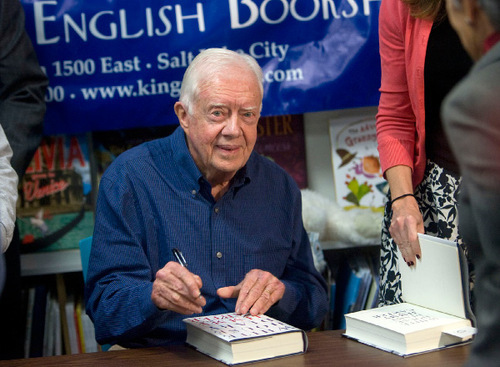 Al Hartmann  |  Salt Lake Tribune 
Former President Jimmy Carter signs his new book 