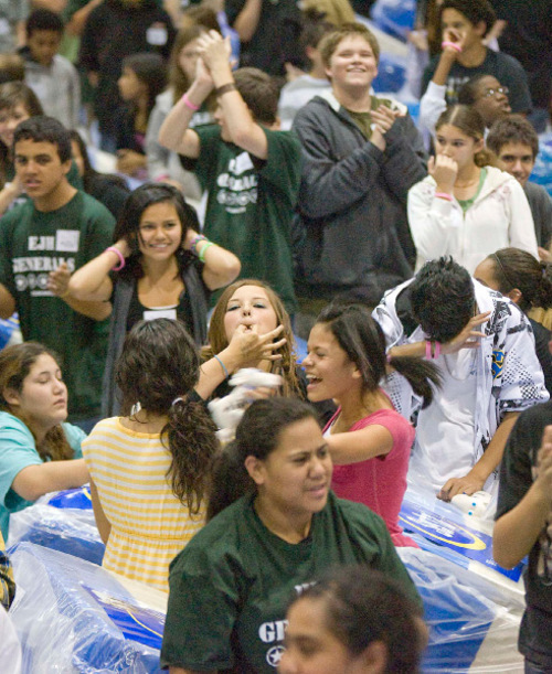 Paul Fraughton  |  The Salt Lake Tribune    Students at Eisenhower Junior High  cheer as it is announced that their attempt to break a Guinness world record for a human/mattress domino chain was a success. With over 600 mattress furnished by RC Willey and Serta Mattress Company, school officials feel confident that the record 620 mattresses  downed in 21.43 seconds  will  be verified by the Guinness judges. Wednesday,October 20, 2010