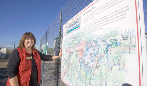 Paul Fraughton  |  The Salt Lake Tribune Chris Schmitz, Hogle Zoo's education coordinator stands outside the construction fence, behind which is being built the 17 million 