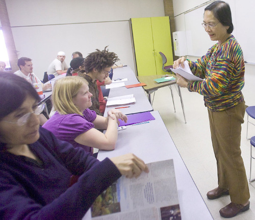 Al Hartmann  |  The Salt Lake Tribune &#xA;Math teacher Celestina N. Punzalan passes out tests in her Math 950 Pre Algebra Class at Salt Lake Community College Redwood Campus.  It is a developmental math class.  &#xA;The State Board of Education appears likely to put on hold for several years a requirement that high school seniors take math. This will be controversial because it was a high-priority of a committee that says Utah needs to make sure students are better educated in math in order to be competitive in the workplace. Too many students have forgotten too much math by the time they get to college and have to be refreshed.