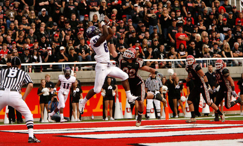 Trent Nelson  |  The Salt Lake Tribune&#xA;TCU's Jimmy Young pulls down a touchdown pass ahead of Utah defender Chaz Walker during the second half, Utah vs. TCU college football, Saturday, November 6, 2010. TCU won 47-7.