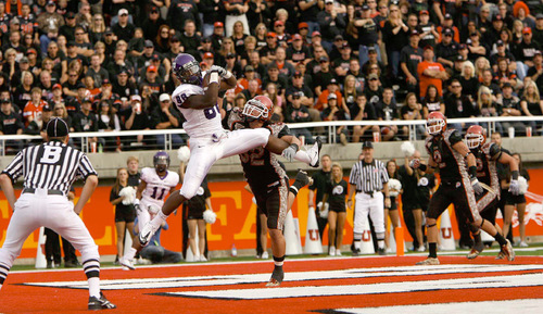 Trent Nelson  |  The Salt Lake Tribune&#xA;TCU's Jimmy Young pulls down a touchdown pass ahead of Utah defender Chaz Walker during the second half, Utah vs. TCU college football, Saturday, November 6, 2010. TCU won 47-7.