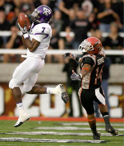 Trent Nelson  |  The Salt Lake Tribune&#xA;TCU's Greg McCoy intercepts a Jordan Wynn pass ahead of defender Reggie Dunn  during the second half, Utah vs. TCU college football, Saturday, November 6, 2010. TCU won 47-7.