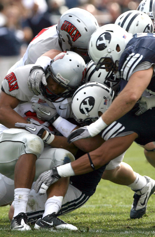 Leah Hogsten  |  The Salt Lake Tribune&#xA;UNLV's Tim Cornett is shut down by BYU's defensive line. &#xA;The BYU Cougars  leads UNLV  38-0 at the half during their Mountain West Conference game at LaVell Edwards Stadium Saturday, November 6, 2010, in Provo.&#xA;
