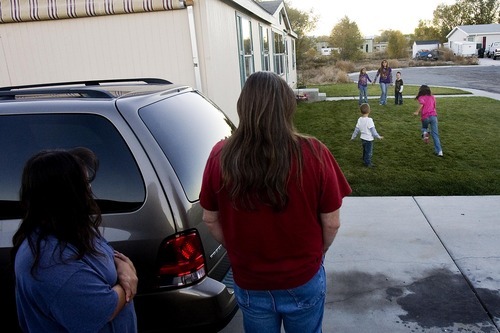 Djamila Grossman  |  The Salt Lake Tribune&#xA;&#xA;Jason and Brenda Chambers watch their kids play at their Wellington home, Thursday, November 4, 2010. Their daughter Kylie is on the Children's Health Insurance Program, under whose recent changes in insurers now require the parents to drive more than 60 miles for her to see a doctor.