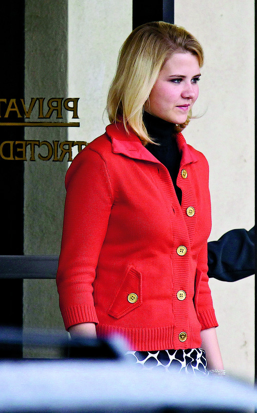 Elizabeth Smart leaves the Frank E. Moss Federal Courthouse Monday, Nov. 8, 2010, in Salt Lake City. Elizabeth Smart took the stand after her mother and younger sister testified. Opening arguments in the Brian David Mitchell trial relating to the kidnapping of Elizabeth Smart in 2002 resumed in Salt Lake City's U.S. District Court Monday after a three-judge panel of the Federal Appeals Court stopped the trial last Thursday in a motion to have it moved out of Utah. (AP Photo/Steve C. Wilson)