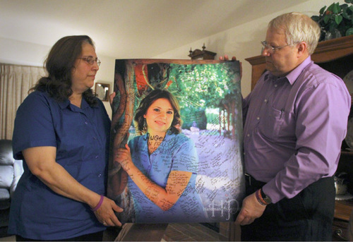 Rick Egan   |  The Salt Lake Tribune

Judy and Chuck Cox, the parents of Susan Cox Powell, hold a photo of their daughter during an interview in their home in Puyallup, Wash., on Wednesday.