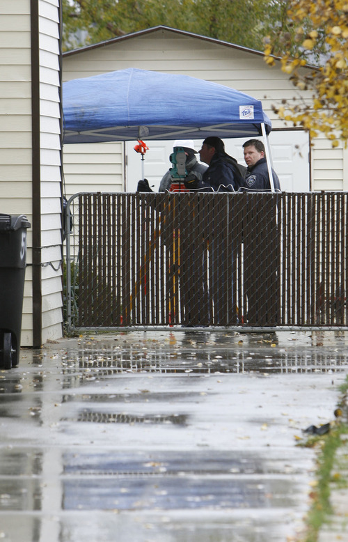 Francisco Kjolseth  |  The Salt Lake Tribune

Police investigate the scene of a home-invasion robbery in Kearns on Loder Drive. Police say the would-be burglar was shot and killed by the homeowner in the early morning hours on Monday, Nov. 8, 2010.