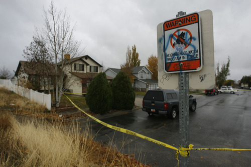 Francisco Kjolseth  |  The Salt Lake Tribune
Police investigate the scene of a home-invasion robbery in Kearns on Loder Drive. Police say the would-be burglar was shot and killed by the homeowner in the early morning hours on Monday, Nov. 8, 2010.