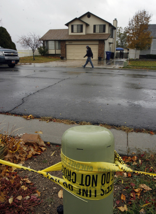 Francisco Kjolseth  |  The Salt Lake Tribune
Police investigate the scene of a home-invasion robbery in Kearns on Loder Drive. Police say the would-be burglar was shot and killed by the homeowner in the early morning hours on Monday, Nov. 8, 2010.