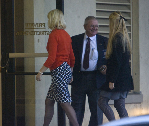 Al Hartmann  |  The Salt Lake Tribune
Elizabeth Smart, left, and her younger sister Mary Katherine are escorted into Frank Moss Federal Courthouse in Salt Lake City to resume the Brian David Mitchell trial on Monday, Nov. 8.