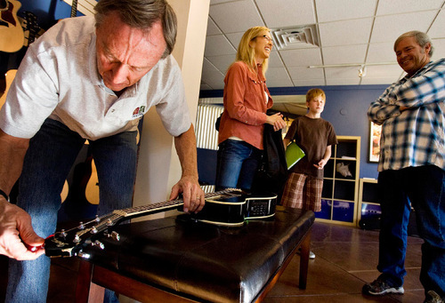 Djamila Grossman  |  The Salt Lake Tribune&#xA;&#xA;Park City Mayor Dana Williams chats with Colin Steele, 11, and his mother Kelly Steele, as Larry Hart tunes a guitar at Riffs, a guitar school, store and coffee shop in Park City, Wednesday, November 3, 2010. Hart owns the place and Williams is the co-manager.
