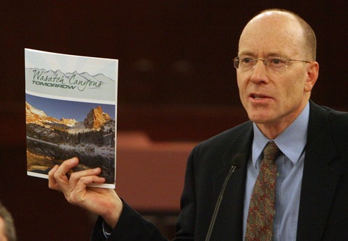 Steve Griffin | The Salt Lake Tribune

Alan Matheson, exeutive director of Envision Utah, holds up a copy of Wasatch Canyons Tomorrow's recommendations during a press conference at the Salt Lake County Council Chambers in Salt Lake City on Monday. The conservation plan will shape the revision of the 1989 Salt Lake County Wasatch Canyons Master Plan for City Creek, Emigration, Red Butte, Parleys, Millcreek, Big Cottonwood, and Little Cottonwood .