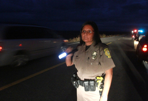 Rick Egan   |  The Salt Lake Tribune&#xA;&#xA;Heather Tolth, Navajo Police, assists the BIA during a traffic stop, near the Navajo reservation between Shiprock New Mexico, and Montezuma Creek, Utah, Thursday, October 21, 2010.