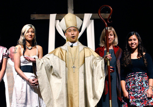 Scott Sommerdorf  l  The Salt Lake Tribune
As his family stands behind him, Scott Hayashi, the newly consecrated Eleventh Bishop Diocesan of The Episcopal Diocese of Utah greets the congregation after the ceremony. The Ordination and Consecration of The Reverend Canon Scott Byron Hayashi as the Eleventh Bishop Diocesan of The Episcopal Diocese of Utah, took place Saturday.