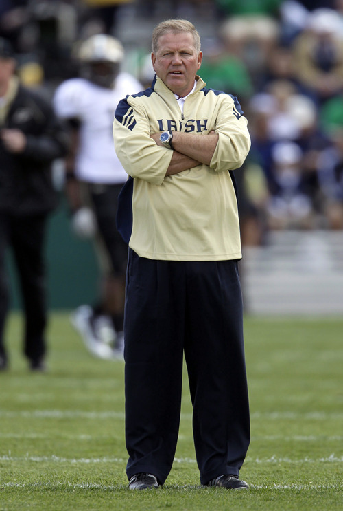 FILE - In this Sept. 4, 2010, file photo, Notre Dame head coach Brian Kelly looks on before an NCAA college football game against Purdue in South Bend, Ind. Kelly knows there are critics everywhere unhappy with him for various reasons. Notre Dame's dismal season for one. They play No. 15 Utah on Saturday.  (AP Photo/Darron Cummings, File)