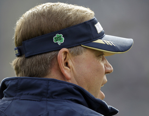 A patch honoring Declan Sullivan, a 20-year-old Notre Dame junior from Long Grove, Ill., who was killed Oct. 27 when a scissor lift in which he had been videotaping football practice toppled over, is shown on the hat of Notre Dame coach Brian Kelly before the start of a NCAA college football game against Tulsa, Saturday, Oct. 30, 2010, in South Bend, Ind. (AP Photo/Michael Conroy)