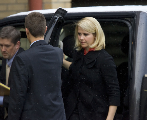 Al Hartmann  |  The Salt Lake Tribune
Elizabeth Smart is escorted into Frank Moss Federal Courthouse in Salt Lake City to testify in the Brian David Mitchell trial on Tuesday, Nov. 9.