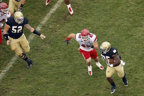 Chris Detrick  |  The Salt Lake Tribune 
Utah Utes linebacker Boo Andersen #45 can't make the tackle on Notre Dame Fighting Irish running back Jonas Gray #25 during the first half of the game at Notre Dame Stadium Saturday November 13, 2010. Notre Dame is winning the game 14-3.