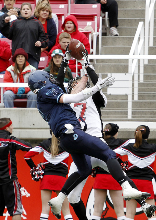 Juan Diego's Konner Kfentzis, left, makes an interception over Hurricane's Taylor Parker during the 3A high school football championships Friday, Nov. 19, 2010, in Salt Lake City. Juan Diego defeated Hurricane for the 3A title 10-7. (Jim Urquhart/ Special to The Salt Lake Tribune)