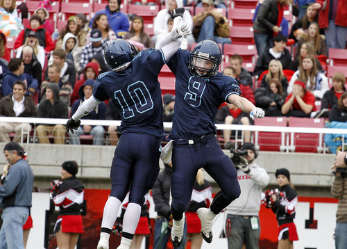 Juan Diego's Cayden Sanchez, left, and Konner Kfentzis celebrate after Kfentzis made an interception during the 3A high school football championships Friday, Nov. 19, 2010, in Salt Lake City. Juan Diego defeated Hurricane for the 3A title 10-7. (Jim Urquhart/ Special to The Salt Lake Tribune)