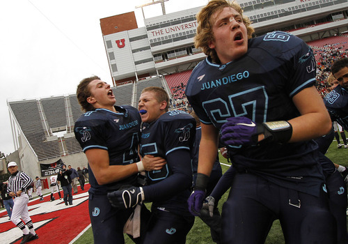 Juan Diego teammates, from left, Nathan Elorreaga, Anthony Barbiero and Harrison Jones celebrate at the end of the 3A high school football championships Friday, Nov. 19, 2010, in Salt Lake City. Juan Diego defeated Hurricane for the 3A title 10-7. (Jim Urquhart/ Special to The Salt Lake Tribune)