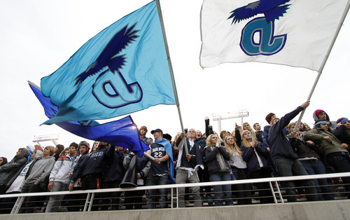 Juan Diego fans wave flags and cheer during the 3A high school football championships Friday, Nov. 19, 2010, in Salt Lake City. Juan Diego defeated Hurricane for the 3A title 10-7. (Jim Urquhart/ Special to The Salt Lake Tribune)