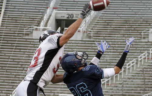 Hurricane's Jarom Healey, left, defends on a pass to Juan Diego's Oliver Weight during the 3A high school football championships Friday, Nov. 19, 2010, in Salt Lake City. Juan Diego defeated Hurricane for the 3A title 10-7. (Jim Urquhart/ Special to The Salt Lake Tribune)