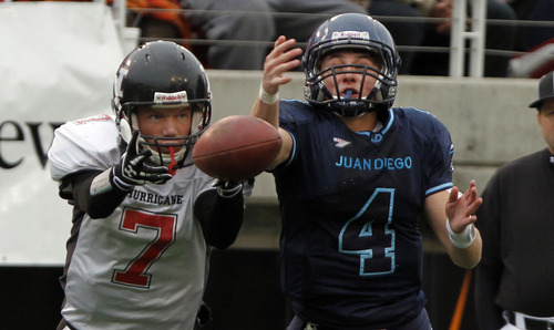 Hurricane's Taylor Parker, left, and Juan Diego's Nathan Elorreaga battle for a pass during the 3A high school football championships Friday, Nov. 19, 2010, in Salt Lake City. Juan Diego defeated Hurricane for the 3A title 10-7. (Jim Urquhart/ Special to The Salt Lake Tribune)