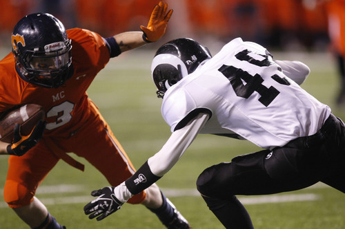 Chris Detrick  |  The Salt Lake Tribune 
Mountain Crest's Dax Fackrell #3 runs around Highland's Hayes Hicken #49 during the first half of the 4A Utah State Championship game at Rice-Eccles Stadium Friday November 19, 2010.  Mountain Crest is winning the game 9-7.