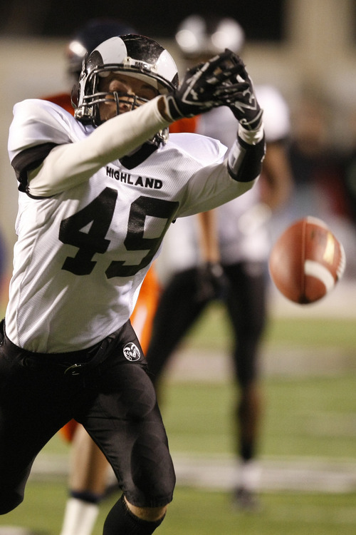 Chris Detrick  |  The Salt Lake Tribune 
Highland's Hayes Hicken #49 can't make a catch during the first half of the 4A Utah State Championship game at Rice-Eccles Stadium Friday November 19, 2010.  Mountain Crest is winning the game 9-7.