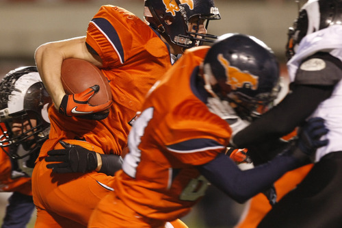 Chris Detrick  |  The Salt Lake Tribune 
Mountain Crest's Braden Fuller #4 runs the ball during the first half of the 4A Utah State Championship game at Rice-Eccles Stadium Friday November 19, 2010.  Mountain Crest is winning the game 9-7.