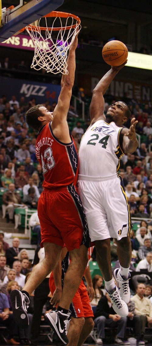 Steve Griffin  |  The Salt Lake Tribune
 
Utah's Paul Millsap glides to the basket as he tries to dunk over New Jersey Nets forward, Kris Humphries, during first half action of the Utah Jazz versus New Jersey Nets basketball game at EnergySolutions Arena in Salt Lake City Wednesday, November 17, 2010. Humphries was called for a foul on the play.