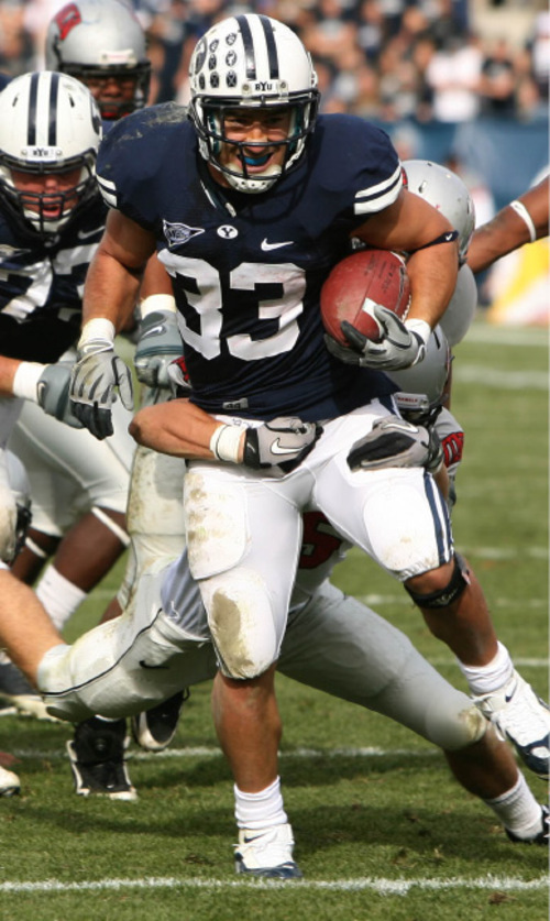 Leah Hogsten  |  The Salt Lake Tribune
BYU running back Bryan Kariya (33)  fights off UNLV's John Therrell. 
The BYU Cougars defeated UNLV  55-7 Saturday during their Mountain West Conference game at LaVell Edwards Stadium Saturday, November 6, 2010, in Provo.