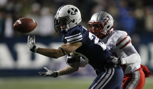 Trent Nelson  |  The Salt Lake Tribune
BYU receiver Luke Ashworth (29) bobbles the ball, during the second half,  BYU vs. New Mexico, Saturday, November 20, 2010. The pass was ruled incomplete. Defending is New Mexico's DeShawn Mills.