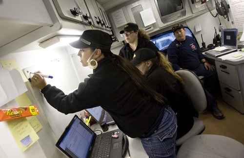 Djamila Grossman  |  The Salt Lake Tribune

Command center dispatchers coordinate crews during a search for a suspect in an officer-involved shooting near Moab, Sunday, Nov. 21, 2010. State park ranger Brody Young of Moab was shot Friday and law enforcement officials have been trying to locate the suspect since.