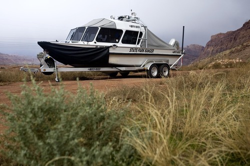 Djamila Grossman  |  The Salt Lake Tribune

A boat sits at the central command center during a search for a suspect in an officer-involved shooting near Moab, Sunday, Nov. 21, 2010. State park ranger Brody Young of Moab was shot Friday and law enforcement officials have been trying to locate the suspect since.