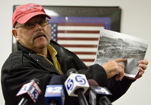 Djamila Grossman  |  The Salt Lake Tribune

Grand County Sheriff Jim Nyland, left, during a Sunday news conference points to a photo of the area around Caveman Ranch, above, near Moab where law enforcement officials are searching.