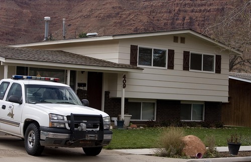 Djamila Grossman  |  The Salt Lake Tribune

A Department of Natural Resources official is parked in front of the home of state park ranger Brody Young in Moab, Sunday, Nov. 21, 2010. Young was injured in a shooting Friday while on duty and law enforcement officials have been looking for the suspect in the area surrounding the town.