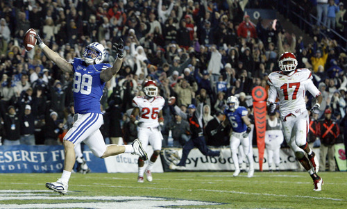 Scott Sommerdorf | The Salt Lake Tribune

BYU tight end Andrew George (88) scores the winning touchdown during overtime in the BYU vs. Utah game at Lavell Edwards Stadium in Provo in 2009.