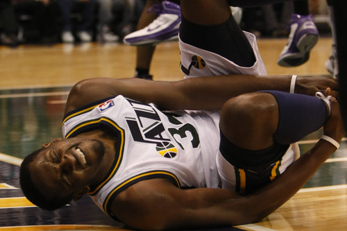 Chris Detrick  |  The Salt Lake Tribune &#xA;Utah Jazz small forward C.J. Miles #34 falls after shooting the ball during the first half of the game at Energy Solutions Arena Friday October 22, 2010.