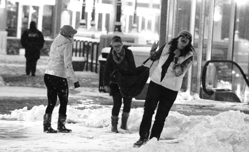 Leah Hogsten  |  The Salt Lake Tribune
l-r Amanda Heller, Molly Menzie and Christine Chachas play in the snow at Gateway after seeing a movie.   A blizzard blew into Salt Lake County just after 5 p.m. Tuesday and was expected to last several hours, according to the National Weather Service. At 6 p.m., the National Weather Service reported that the blizzard should dump snow for up to four hours. Poor visibility, strong winds, blowing snow and dangerous driving conditions were also present throughout northern Utah. Tuesday, November 23, 2010, in SLC.