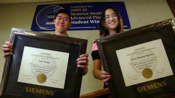 Steve Griffin  |  The Salt Lake Tribune
Cottonwood High School seniors Luke Hsiao and Uyen-Phuong Nguyen hold the plaques they received for being this year's recipients for the Siemens Award. Each year, the top male and female Advanced Placement student in science and math subjects in each state are given the award for Advanced Placement (SAAP). Students are eligible for the $2,000 scholarship if they receive at least two scores of 5 (that's the best you can get) on AP math and science tests.